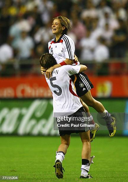Sandra Smisek and Annike Krahn of Germany celebrate victory at the final whistle in the Women's World Cup 2007 Final between Brazil and Germany at...