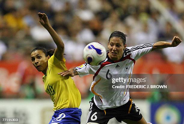 Linda Bresonik of Germany vies for the ball with Marta of Brazil during their final match in the FIFA Women's World Cup 2007 football tournament at...