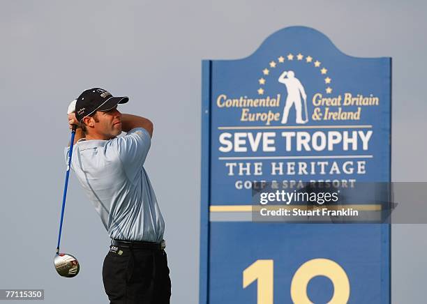 Bradley Dredge of The Great Britain and Ireland Team plays his tee shot on the 18th hole during the final day singles at the Seve Trophy 2007 held at...
