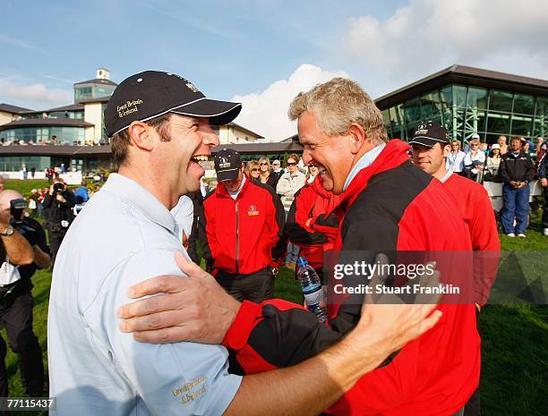 Bradley Dredge and Colin Montgomerie of The Great Britain and Ireland Team celebrate after the final day singles at the Seve Trophy 2007 held at The...