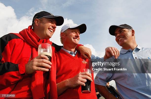 Graeme Storm, Simon Dyson and Phillip Archer of The Great Britain and Ireland Team celebrate their teams win with a pint of Guinness after the final...