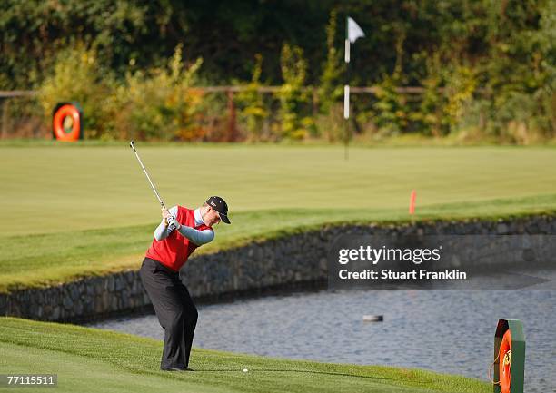 Marc Warren of The Great Britain and Ireland Team plays his approach shot on the fourth hole during the final day singles at the Seve Trophy 2007...