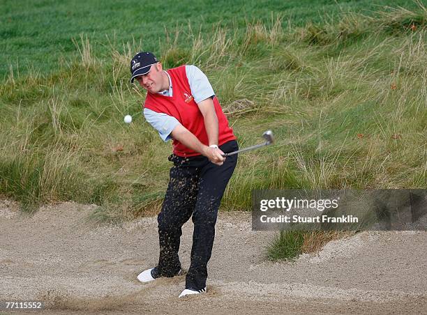 Graeme Storm of The Great Britain and Ireland Team plays his bunker shot on the eighth hole during the final day singles at the Seve Trophy 2007 held...