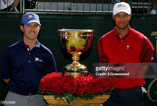 Mike Weir of the International team and Tiger Woods of the U.S. Team pose prior to the final day singles matches of The Presidents Cup on September...