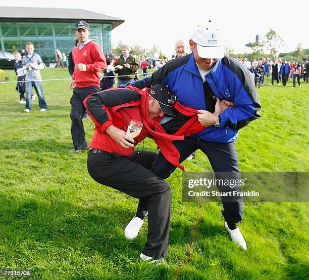 Graeme Storm of The Great Britain and Ireland Team with Thomas Bjorn of The European Team joke about during the final day singles at the Seve Trophy...