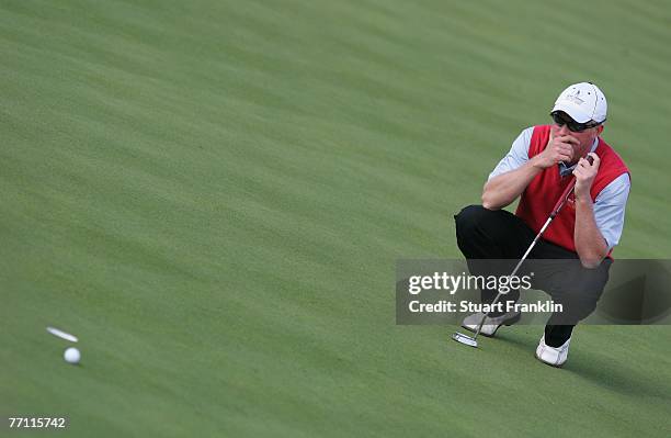 Simon Dyson of The Great Britain and Ireland Team lines up a putt on the eighth hole during the final day singles at the Seve Trophy 2007 held at The...