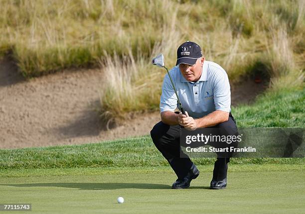 Phillip Archer of The Great Britain and Ireland Team lines up a putt on the eighth hole during the final day singles at the Seve Trophy 2007 held at...