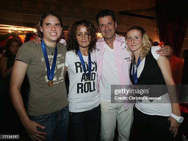 Annike Krahn, Fatmire Bajramaj, Pur singer Hartmut Engler and Anja Mittag celerate during the German Womens National team party, following the world...