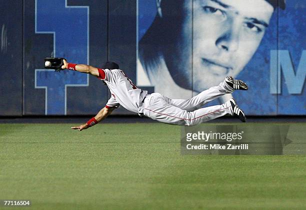 Boston center fielder Coco Crisp makes a diving catch during the game between the Atlanta Braves and the Boston Red Sox at Turner Field in Atlanta,...