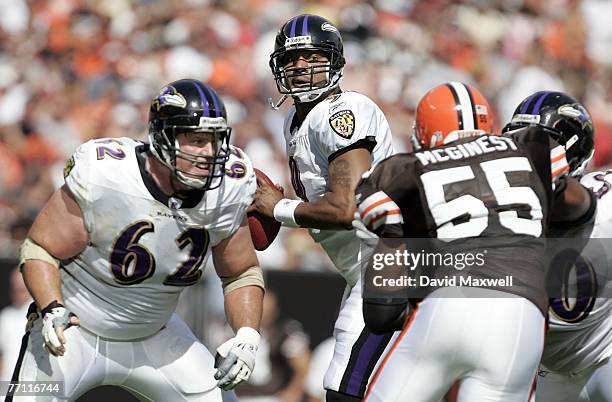 Mike Flynn of Baltimore Ravens protects quarterback Steve McNair as Willie McGinest of the Cleveland Browns pressures in the first quarter at...