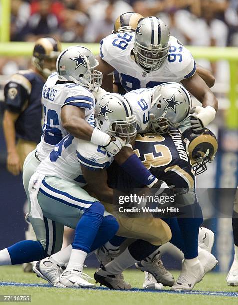 Brian Leonard of the St. Louis Rams is gang tackled by the Dallas Cowboys defense at Texas Stadium September 30, 2007 in Dallas, Texas. The Cowboys...