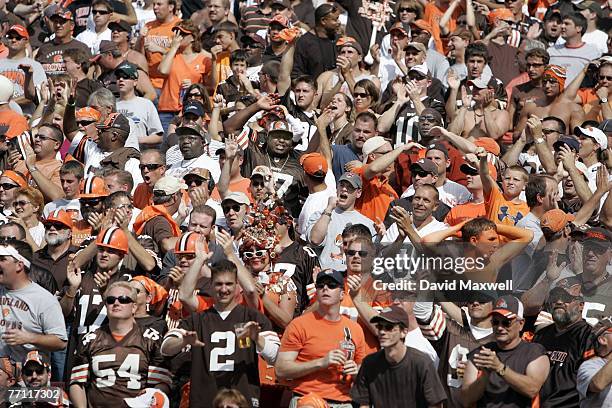 Cleveland Browns fans celebrate as they watch the game between the Cleveland Browns and the Baltimore Ravens in the second quarter at Cleveland...