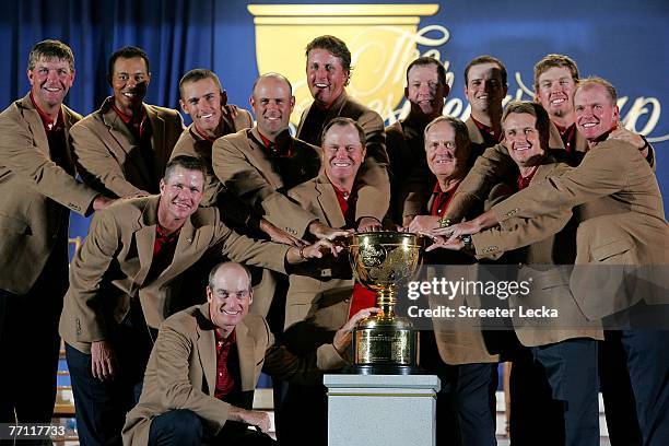 The victorious U.S. Team celebrates with the trohphy after winning The Presidents Cup at The Royal Montreal Golf Club on September 30, 2007 in...