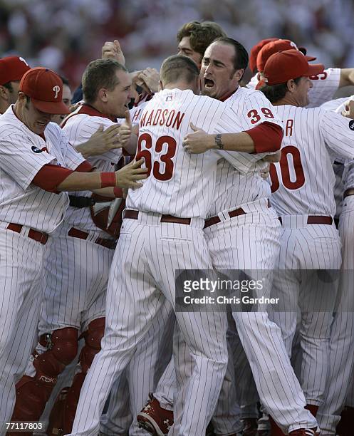 Brett Myers of the Philadelphia Phillies celebrates with teammate Ryan Madson after Myers struck out Wily Mo Pena of the Washington Nationals to give...