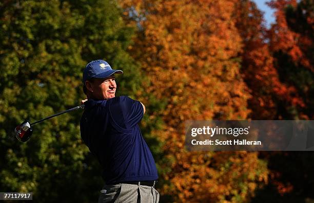 Ernie Els of the International team hits his tee shot on the 14th hole during the final day singles matches at The Presidents Cup at The Royal...