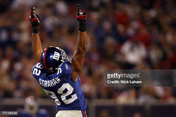 Michael Strahan of the New York Giants celebrates in the second quarter after becoming the Giants all time sack leader against the Philadelphia...