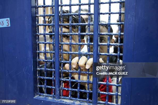 Palestinian prisoners stand in a cell pending their release from Ketziot prison camp in southern Israel's Negev desert 01 October 2007. Israel said...