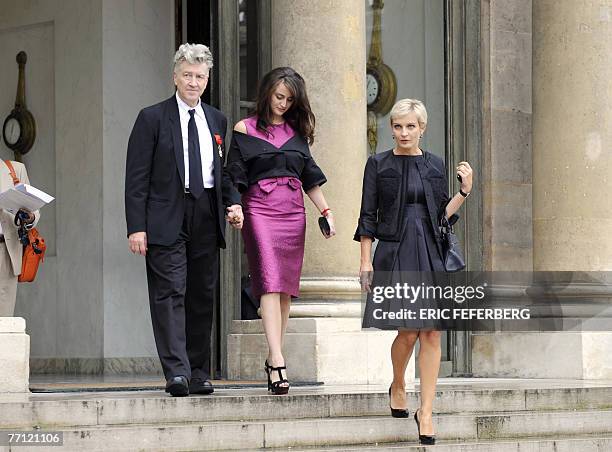 Filmmaker, David Lynch leaves the Elysee presidential Palace with his girl friend Emily Stofle and Melita Toscan du Plantier after being awarded with...