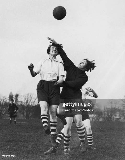 Members of Preston Ladies' Football Club vie for the ball during practice in Preston. Lancashire, 31st March 1937. The team is preparing for a match...