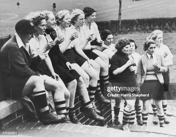 Members of Preston Ladies' Football Club take a break to enjoy their milk ration, Preston, Lancashire, 30th March 1939.