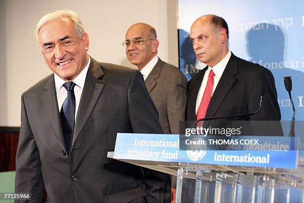 French Socialist Dominique Strauss-Kahn, newly appointed at the head of the International Monetary Fund, smiles after giving a press conference at...