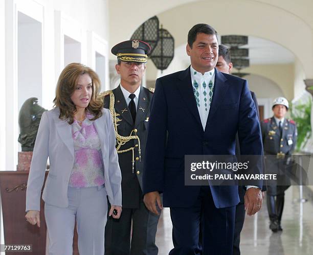 Ecuadorean president Rafael Correa arrives accompanied by members of his staff 01 October 2007 at the Carondelet presidential palace in Quito. The...
