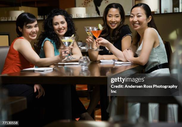 multi-ethnic female friends at bar - martini stock pictures, royalty-free photos & images
