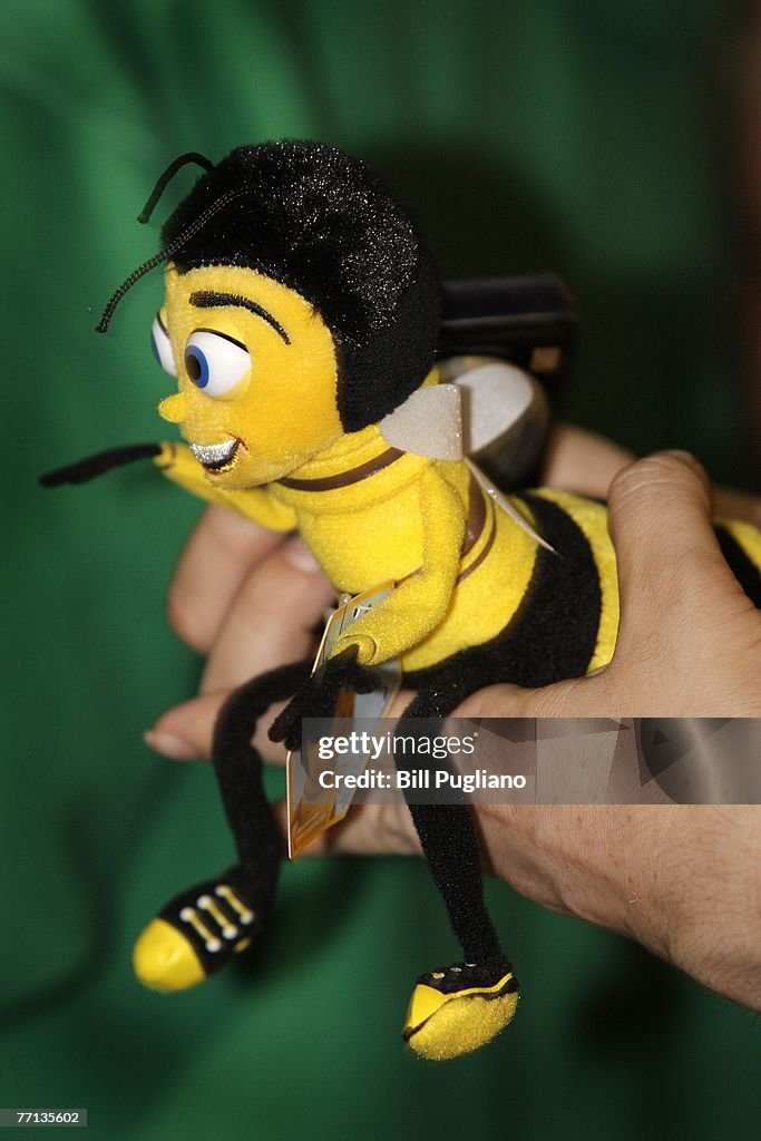A fan holds a promotional doll for Jerry Seinfeld's new movie