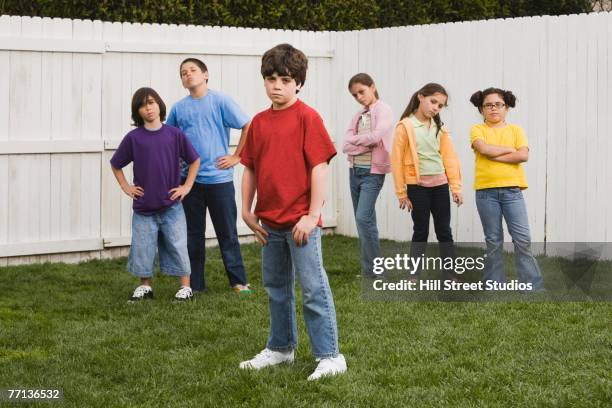 mixed race children posing in yard - bad brother stock pictures, royalty-free photos & images