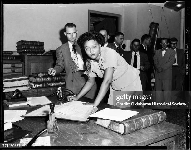 American civil rights activist Ada Lois Sipuel Fisher signing the Register of Attorneys, Oklahoma City, Oklahoma, July 1, 1952.