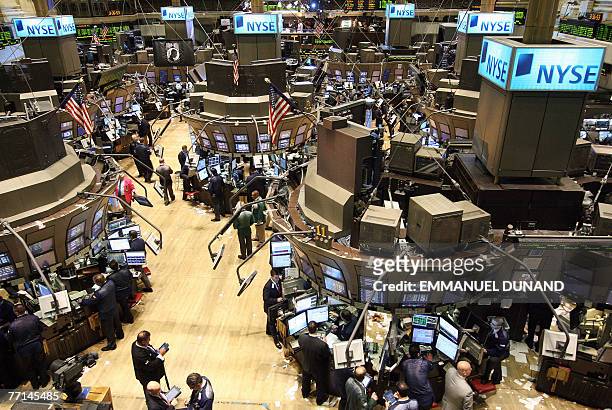 New York Stock Exchange traders deal on the market floor in New York 01 October 2007. Wall Street shares kicked off the fourth quarter with gusto,...