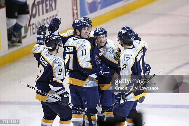 Members of the Nashville Predators celebrate after scoring a goal during 1st-period action against the San Jose Sharks at the Gaylord Entertainment...