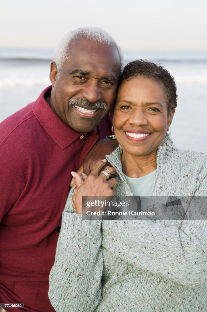 Senior African American couple hugging