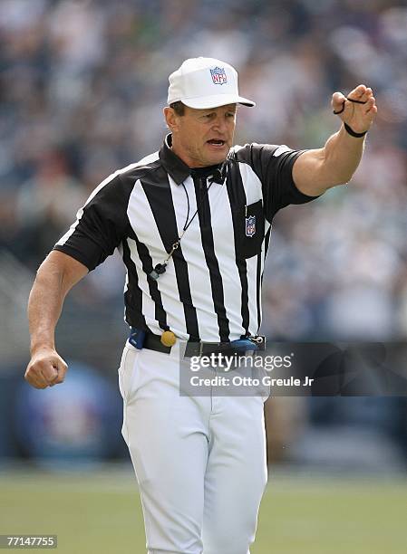 Referee Ed Hochuli signals during the Seattle Seahawks game against the Cincinnati Bengals at Qwest Field on September 23, 2007 in Seattle,...