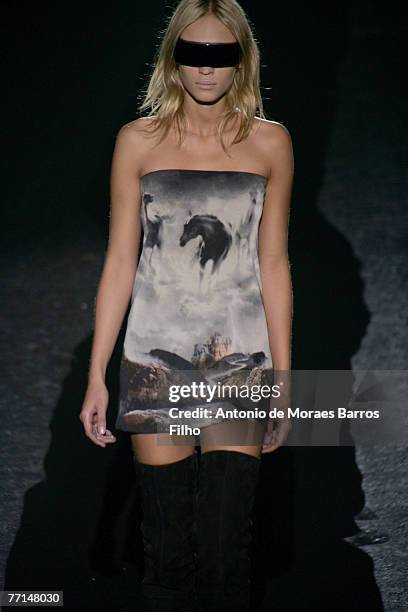 Model walks down the catwalk during the Maison Martin Margiela Pr?t-?-Porter show as part of Paris Fashion Week Spring/Summer 2008 on October 1, 2007...