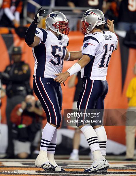 Mike Vrabel and Tom Brady of the New England Patriots celebrate after a touchdown reception by Vrabel against the Cincinnati Bengals during the NFL...
