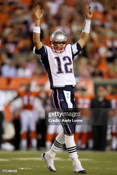 Tom Brady of the New England Patriots signals a touchdown against the Cincinnati Bengals during the NFL game on October 1, 2007 at Paul Brown Stadium...