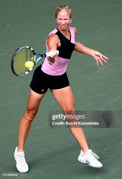 Jill Craybas of USA hits a return shot against Venus Williams of USA during day two of the AIG Japan Open Tennis Championships held at Ariake...