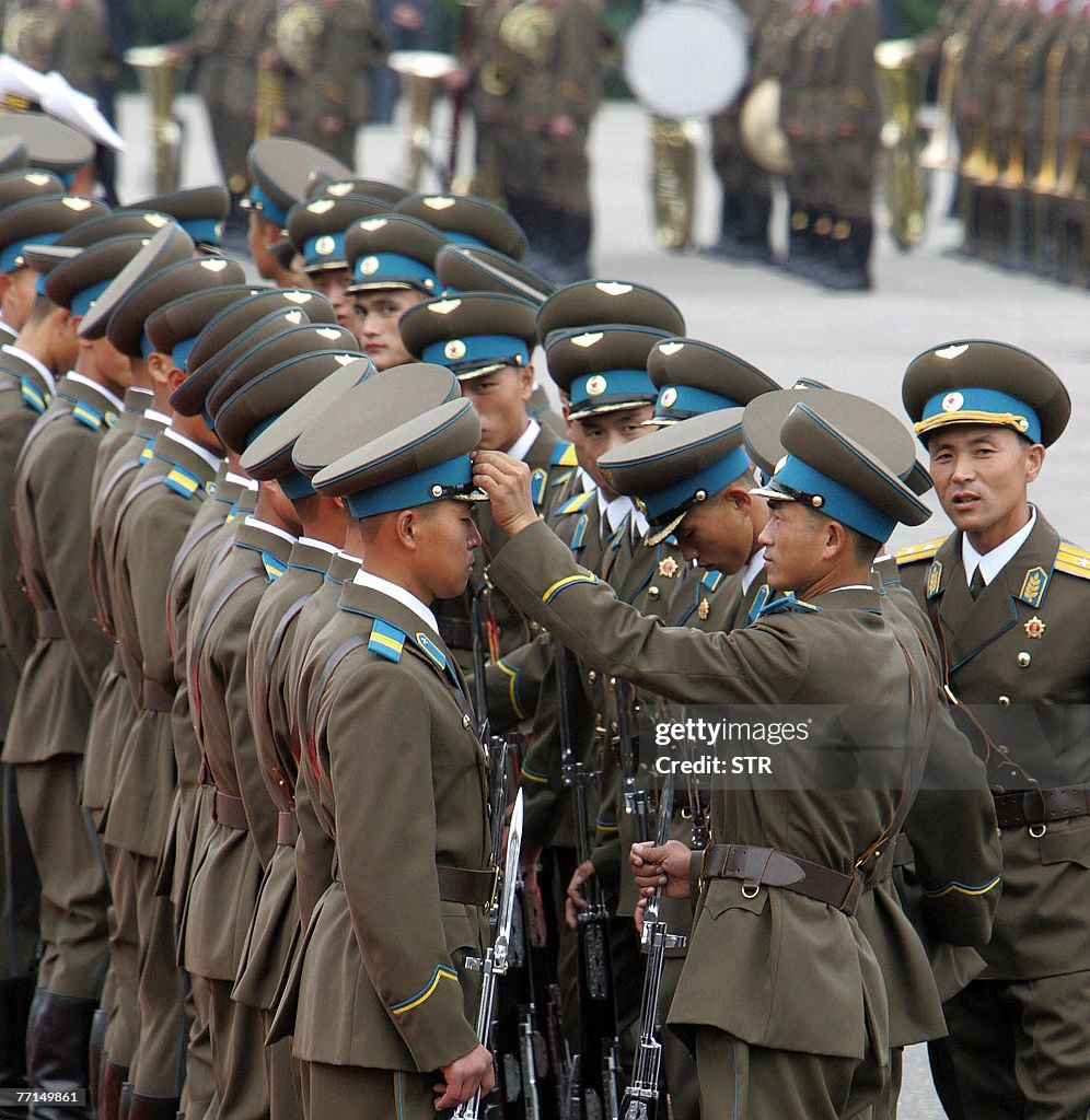 North Korean soldiers get ready to parad
