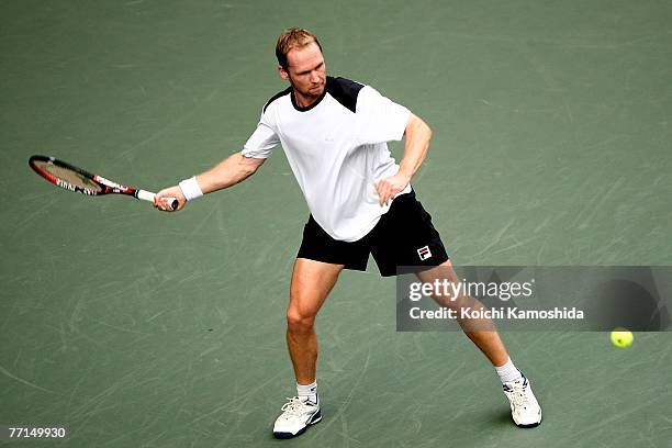 Rainer Schuettler of Germany hits a return shot against Go Soeda of Japan during day two of the AIG Japan Open Tennis Championships held at Ariake...