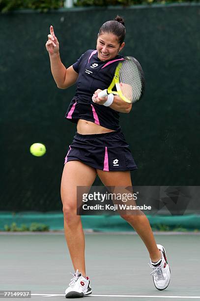 Jelena Kostanic Tosic of Croatia hits a return shot against Lourdes Dominguez Lino during Day 2 of the AIG Japan Open Tennis Championships held at...
