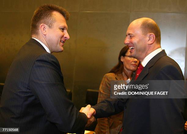 German Transport Minister Wolfgang Tiefensee talks with his Latvian counterpart Algirdas Butkevicius before a Transport, Telecommunications and...
