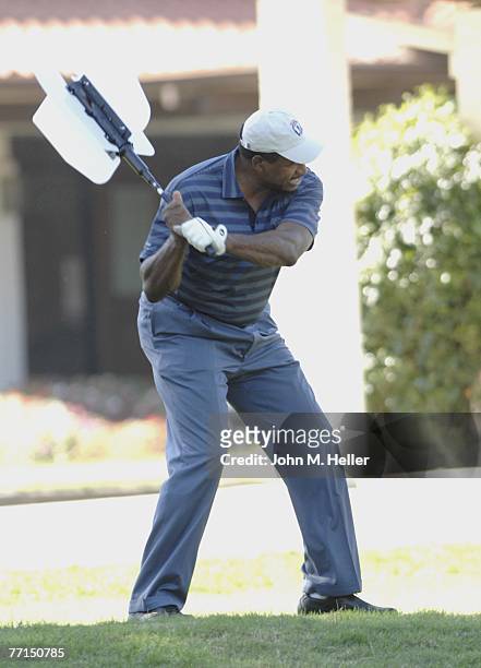 Dave Winfield takes batting practice on the first hole with a swing trainer at the 9th Annual Elizabeth Glaser Pediatric Aids Foundation Celebrity...