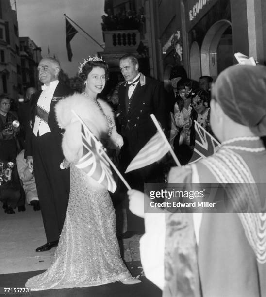 Queen Elizabeth II arrives at Claridges Hotel in London, as the guest of a banquet held by King Paul and Queen Frederika of Greece, 11th July 1963.