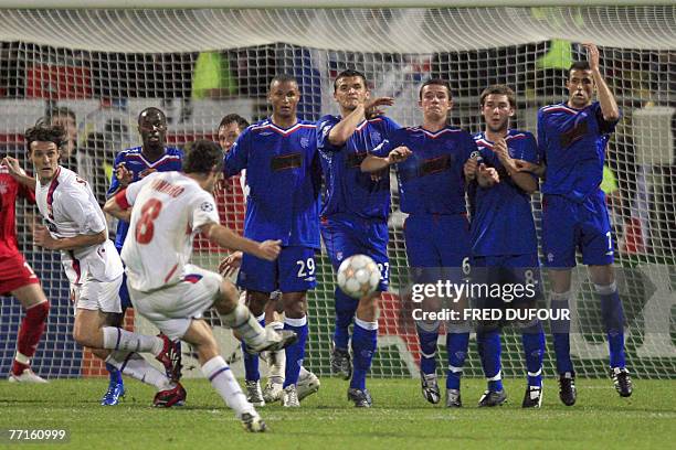 Lyon's midfielder Juninho Pernambucano kicks a penalty during their UEFA Champions League Group E match Lyon vs Glasgow Rangers at Gerland' Stadium,...