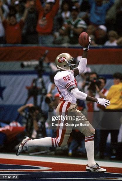 Wide receiver John Taylor of the San Francisco 49ers runs in the end zone for a touchdown in Super Bowl XXIV against the Denver Broncos at Louisiana...