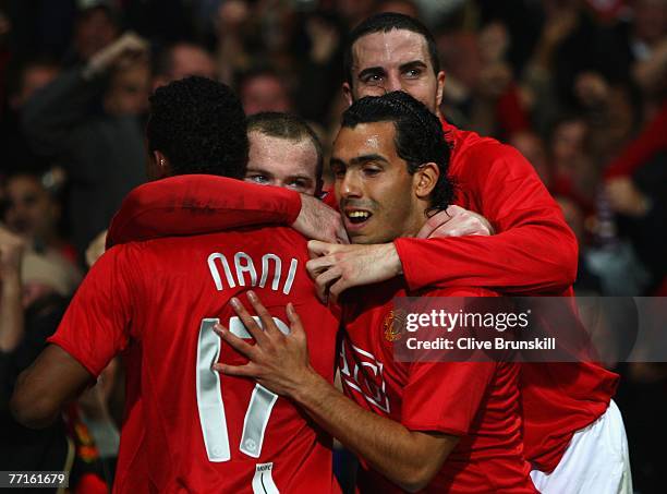 Wayne Rooney of Manchester United celebrates with John O'Shea , Luis Nani and Carlos tevez as he scores their first goal during the UEFA Champions...