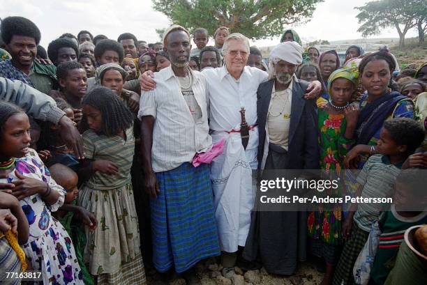 Austrian actor KarlHeinz Bohm meets villagers as he visits an opening of a water project for several villages in a rural area February 7, 2001...