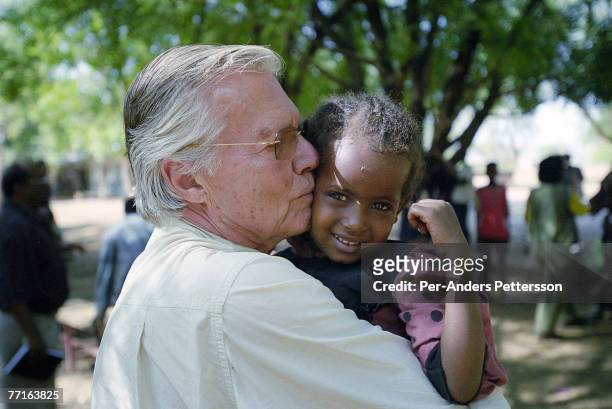 Austrian actor KarlHeinz Bohm meets villagers as he visits an opening of a water project for several villages in a rural area February 7, 2001...
