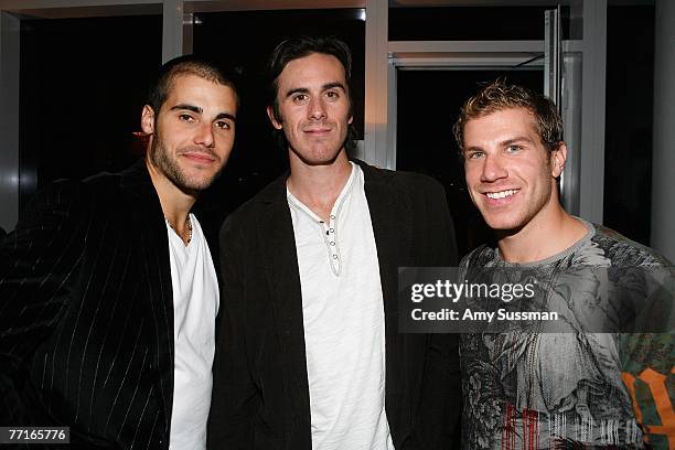 Rick DiPietro of the New York Islanders poses with Buffalo Sabres players Ryan Miller and Derek Roy at the NHL and Esquire season launch party at...